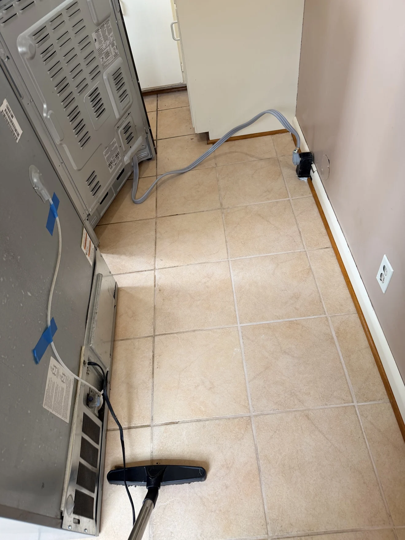Floor behind refrigerator after cleaning